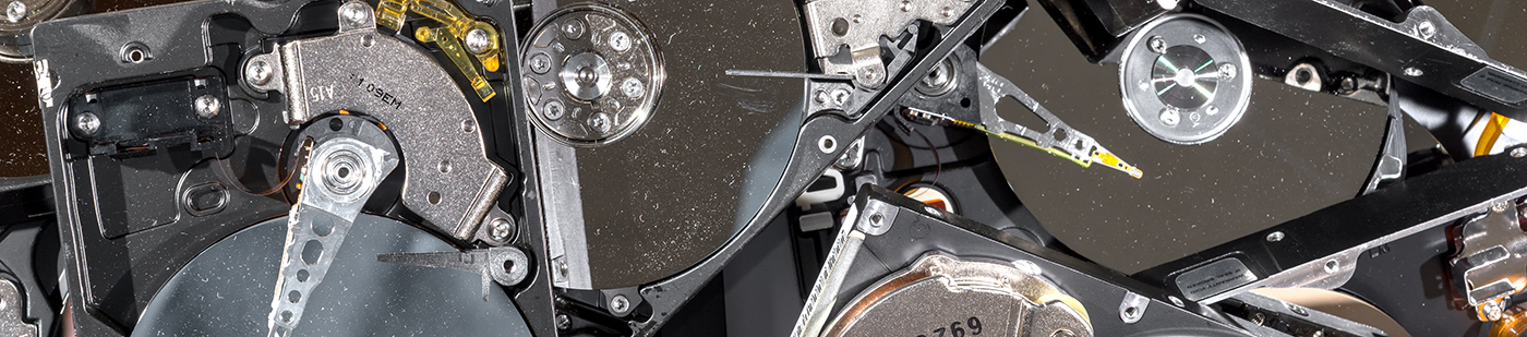 Computer hard drives being recycled. The drives have the tops re